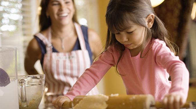 mom and daugther baking kitchen